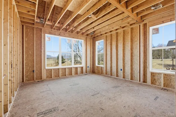a living room with furniture and a shower