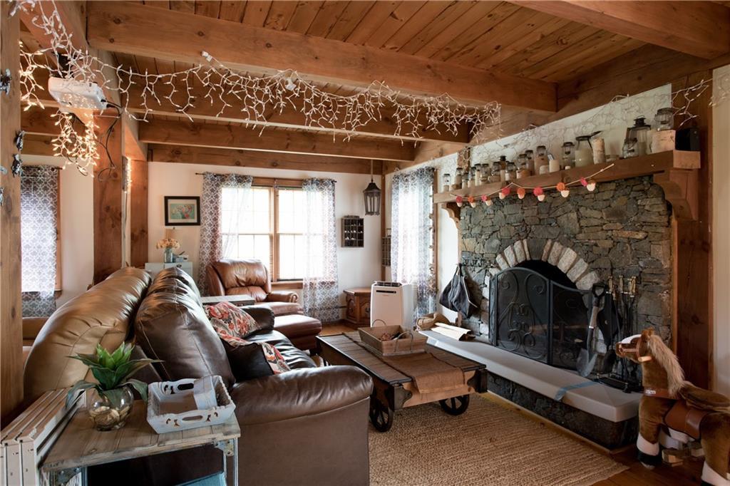 604 Emerys Bridge Road South Berwick, ME 03908 - Photo 11 of 26 The living room boasts a huge stone...