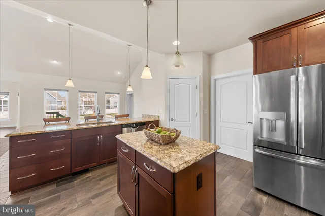 a kitchen with a stove sink and refrigerator