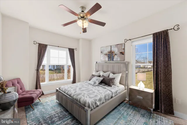 a bedroom with a large bed and a window