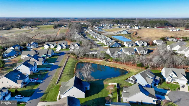 an aerial view of a houses with swimming pool and outdoor space