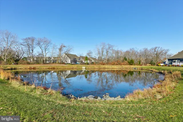 a view of a lake with houses with outdoor space
