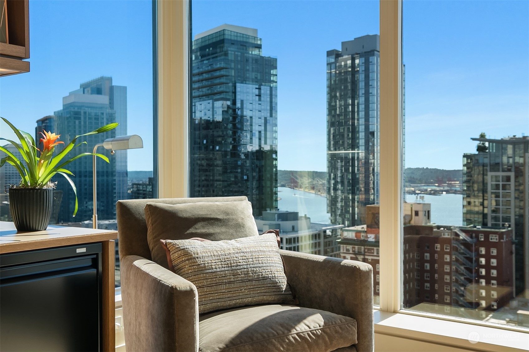 1920 4th Avenue, Unit 2401 Seattle, WA 98101 - Photo 19 of 40 a balcony with furniture and a potted plant