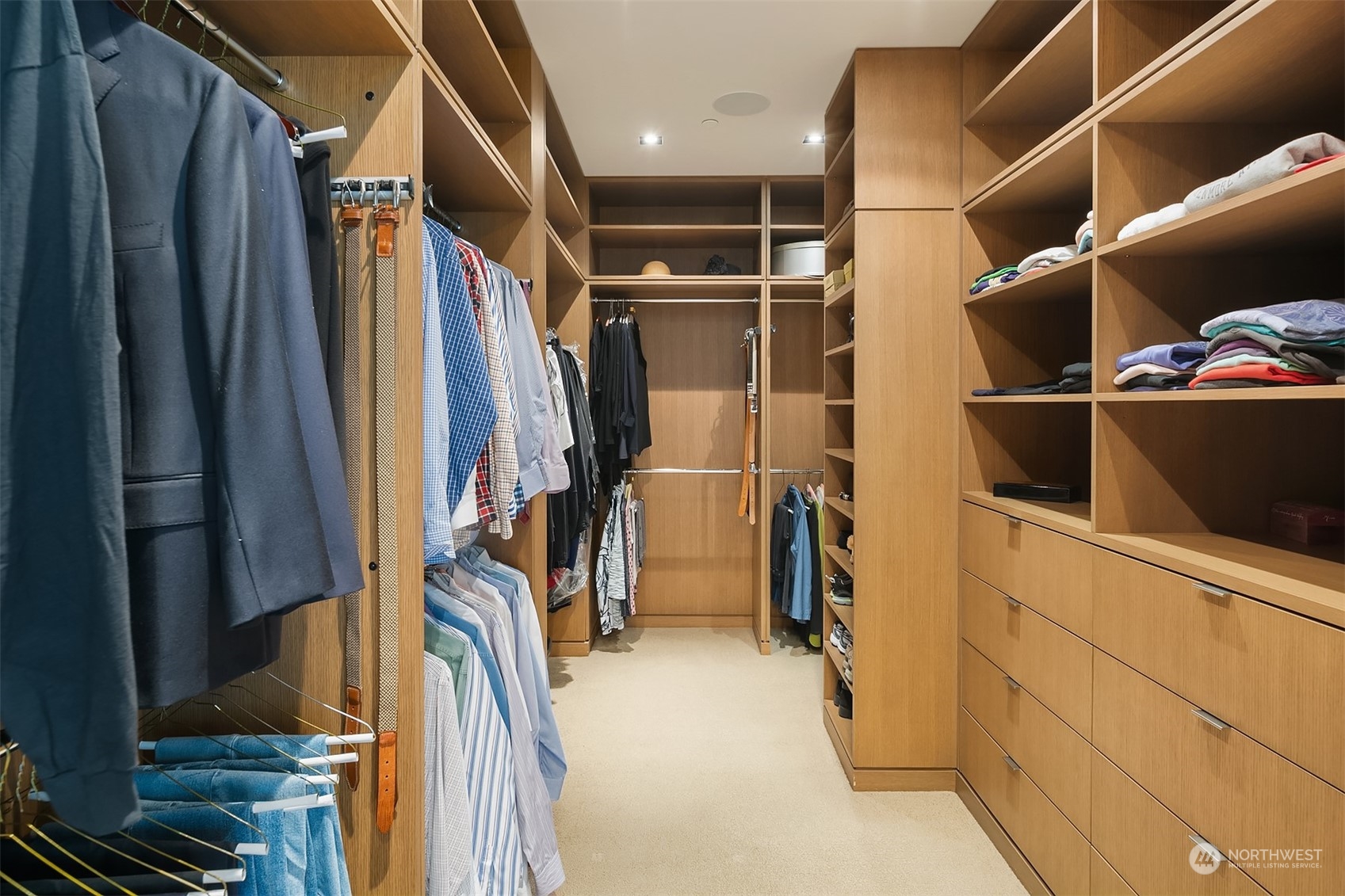 1920 4th Avenue, Unit 2401 Seattle, WA 98101 - Photo 26 of 40 a view of walk in closet with clothes and shoes
