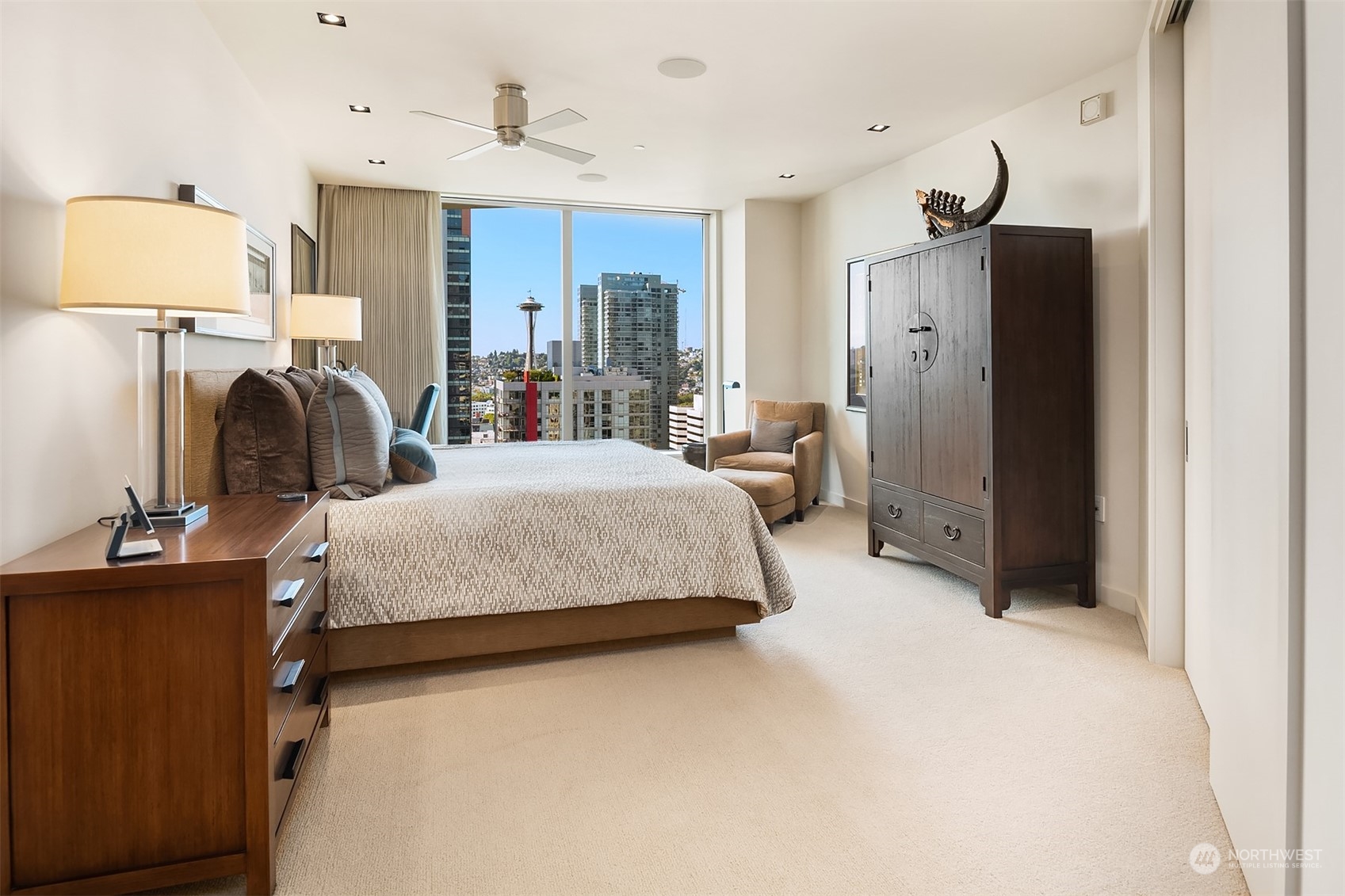 1920 4th Avenue, Unit 2401 Seattle, WA 98101 - Photo 31 of 40 a bedroom with bed and window