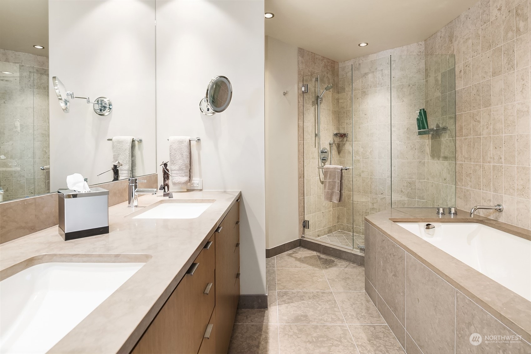 1920 4th Avenue, Unit 2401 Seattle, WA 98101 - Photo 32 of 40 a spacious bathroom with a tub sink shower and mirror