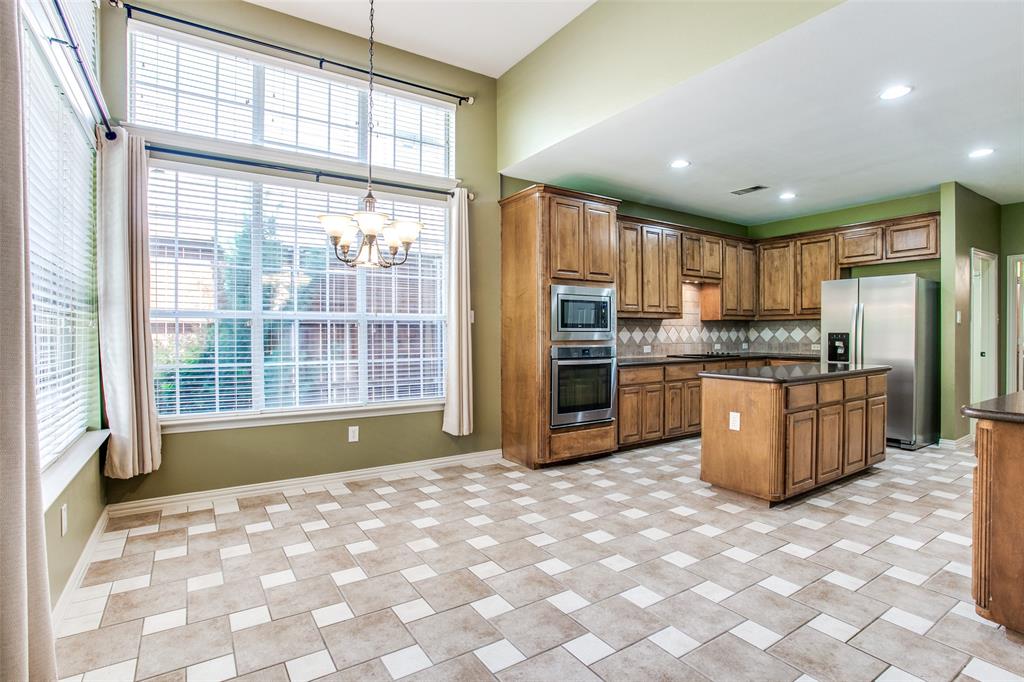1318 Haddington Lane Keller, TX 76248 - Photo 12 of 37 a kitchen with stainless steel appliances granite countertop a refrigerator and a stove top oven