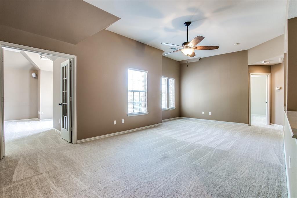 1318 Haddington Lane Keller, TX 76248 - Photo 16 of 37 a view of an empty room with window and a ceiling fan