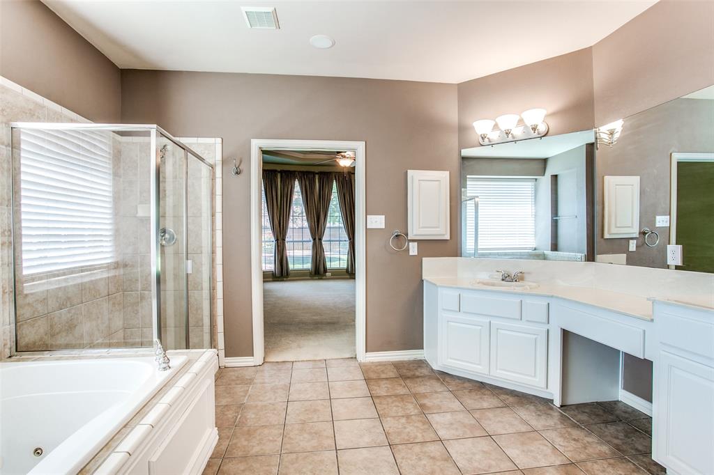 1318 Haddington Lane Keller, TX 76248 - Photo 21 of 37 a spacious bathroom with a tub sink and mirror