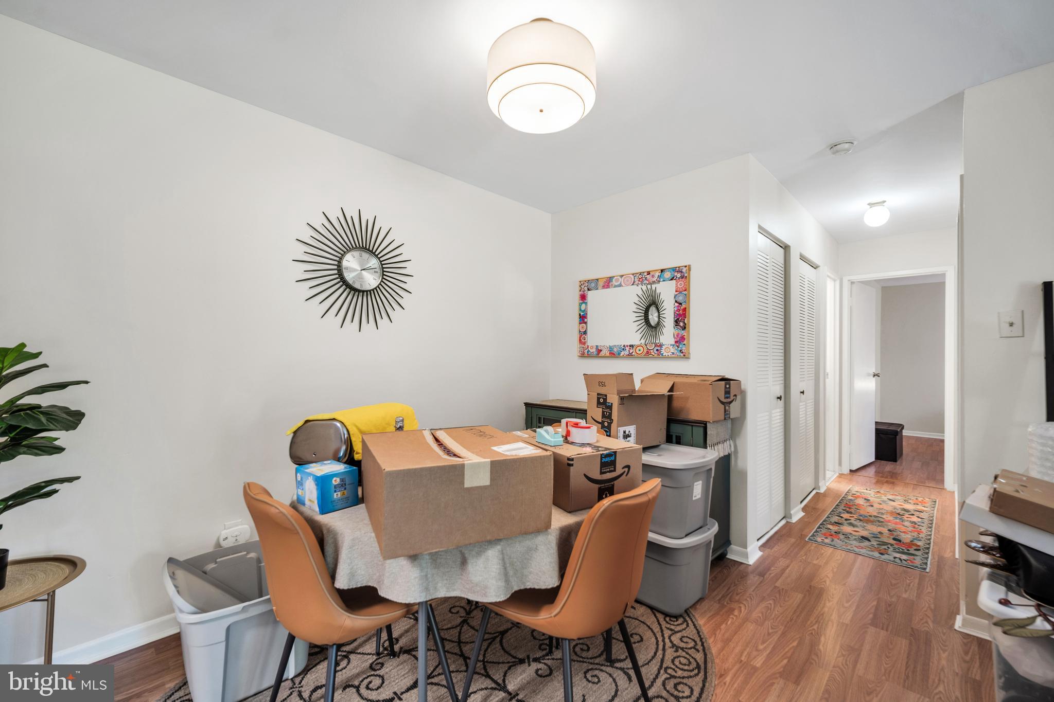 50103 Delaire Landing Road, Unit 50103 Philadelphia, PA 19114 - Photo 15 of 27 a view of a dining room with furniture and wooden floor