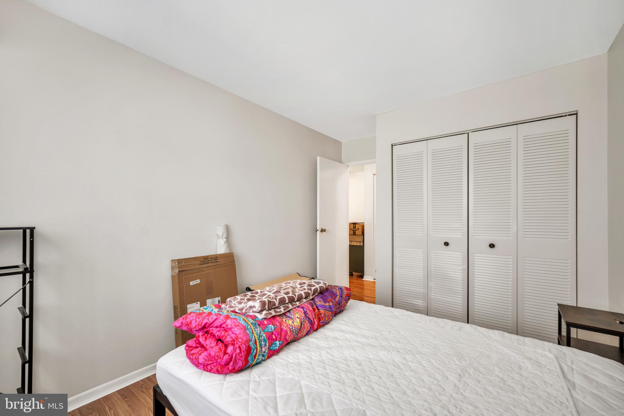 50103 Delaire Landing Road, Unit 50103 Philadelphia, PA 19114 - Photo 17 of 27 a bedroom with a bed and a closet