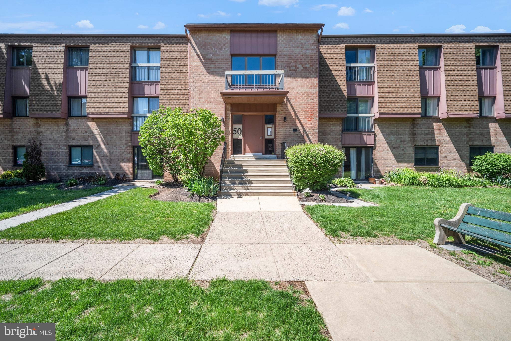 50103 Delaire Landing Road, Unit 50103 Philadelphia, PA 19114 - Photo 2 of 27 a front view of a house with garden