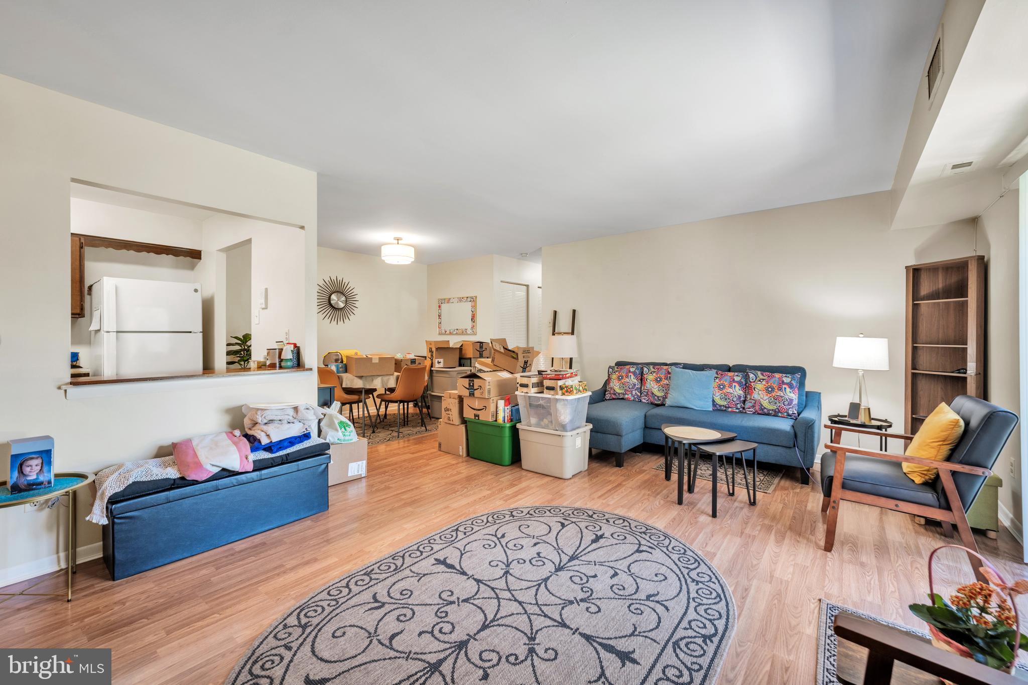 50103 Delaire Landing Road, Unit 50103 Philadelphia, PA 19114 - Photo 23 of 27 a living room with furniture and a wooden floor