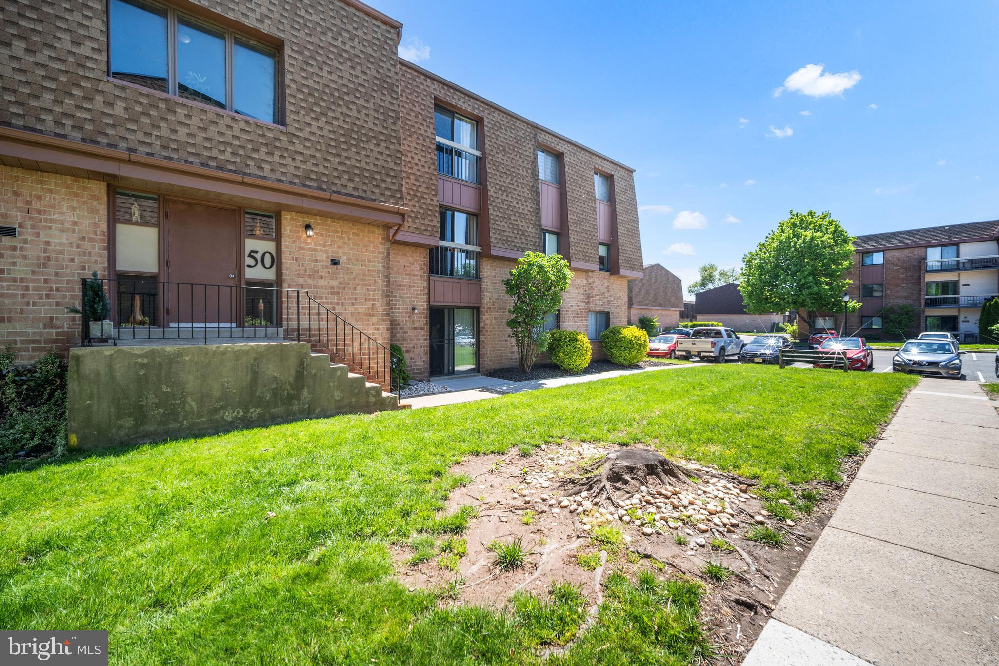 50103 Delaire Landing Road, Unit 50103 Philadelphia, PA 19114 - Photo 5 of 27 a view of a house with a yard and plants