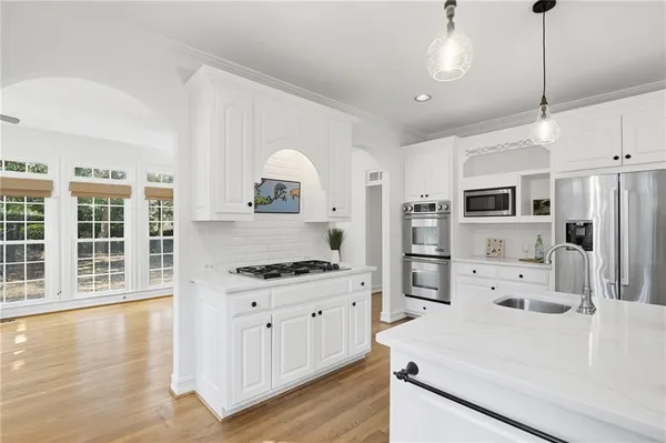 a kitchen with a sink and cabinets