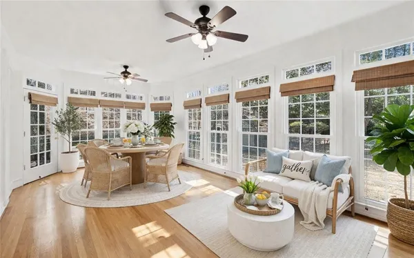a view of a dining room with furniture window and wooden floor