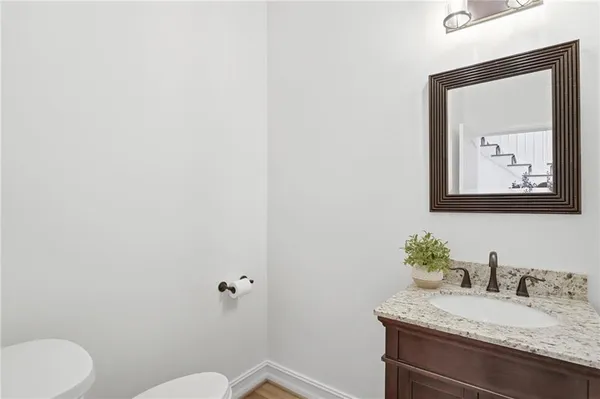 a bathroom with a tub shower and sink