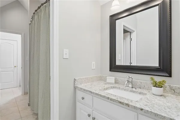 a view of a building from a chairs and table in the patio