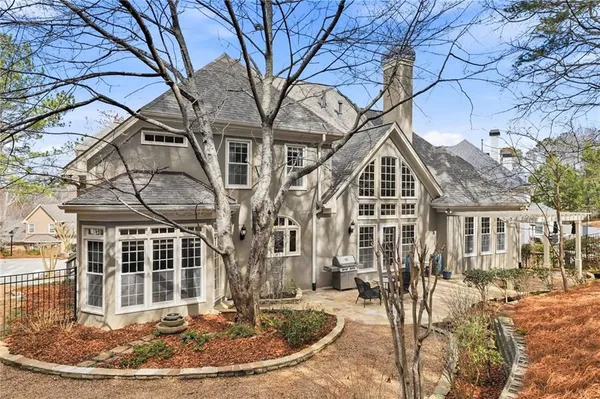 an aerial view of a house with garden space and street view