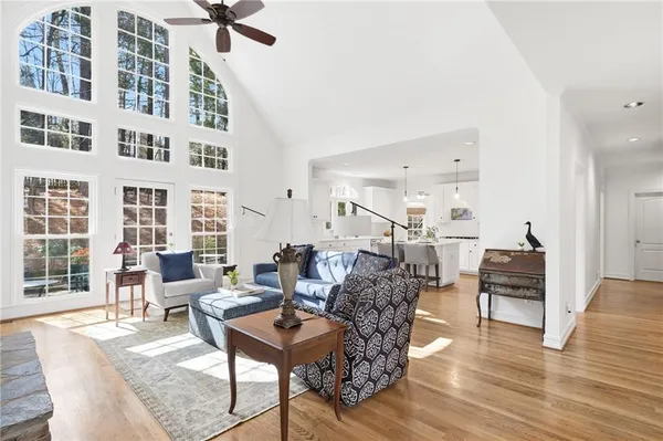 a living room with furniture fireplace and flat screen tv