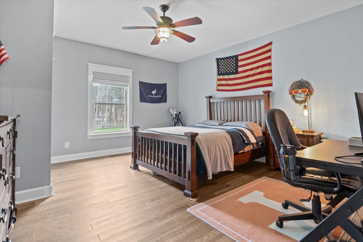 8006 Rose Ridge Pvt Lane Fairview, TN 37062 - Photo 31 of 87 a bedroom with a bed a dresser and a window