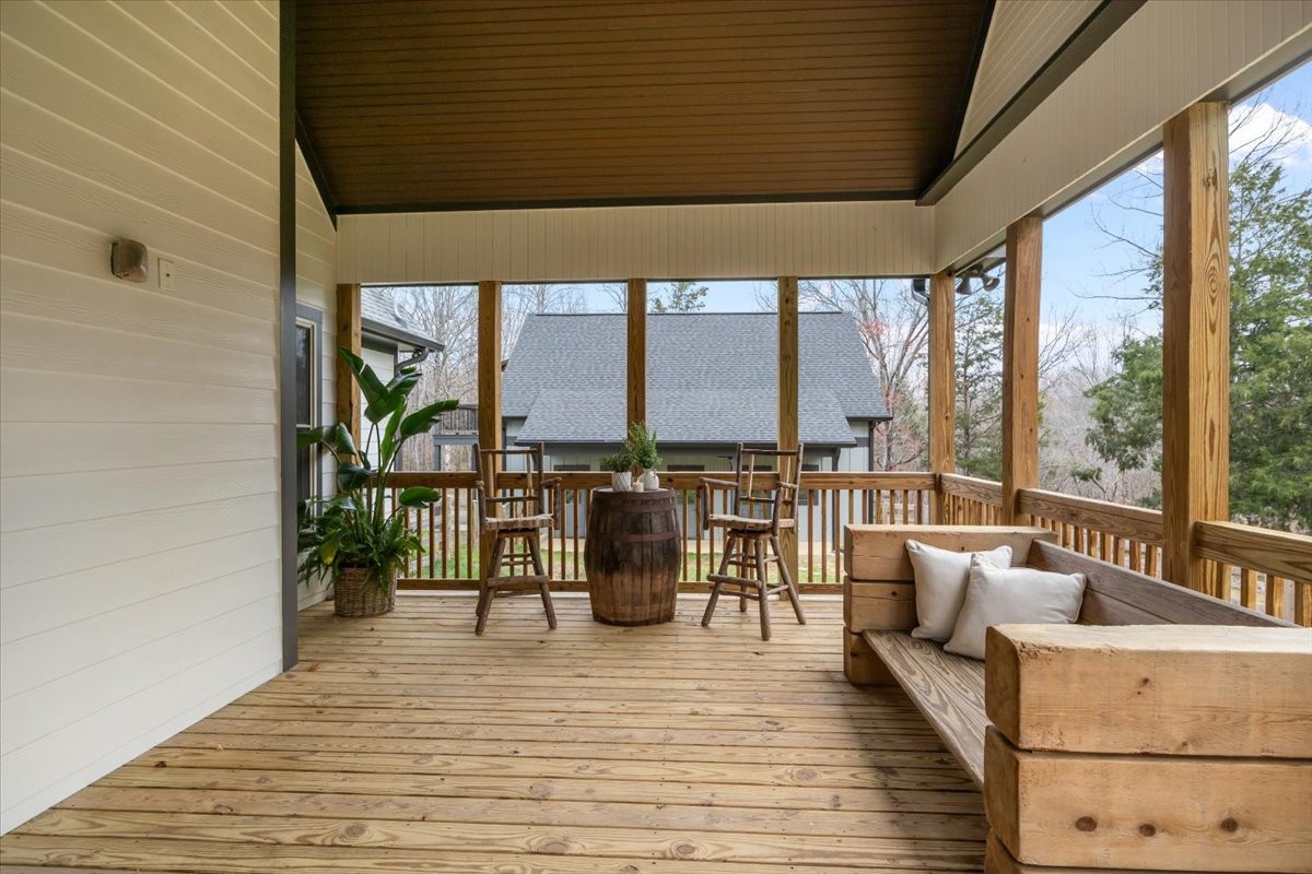 8006 Rose Ridge Pvt Lane Fairview, TN 37062 - Photo 37 of 87 a balcony with furniture and wooden floor