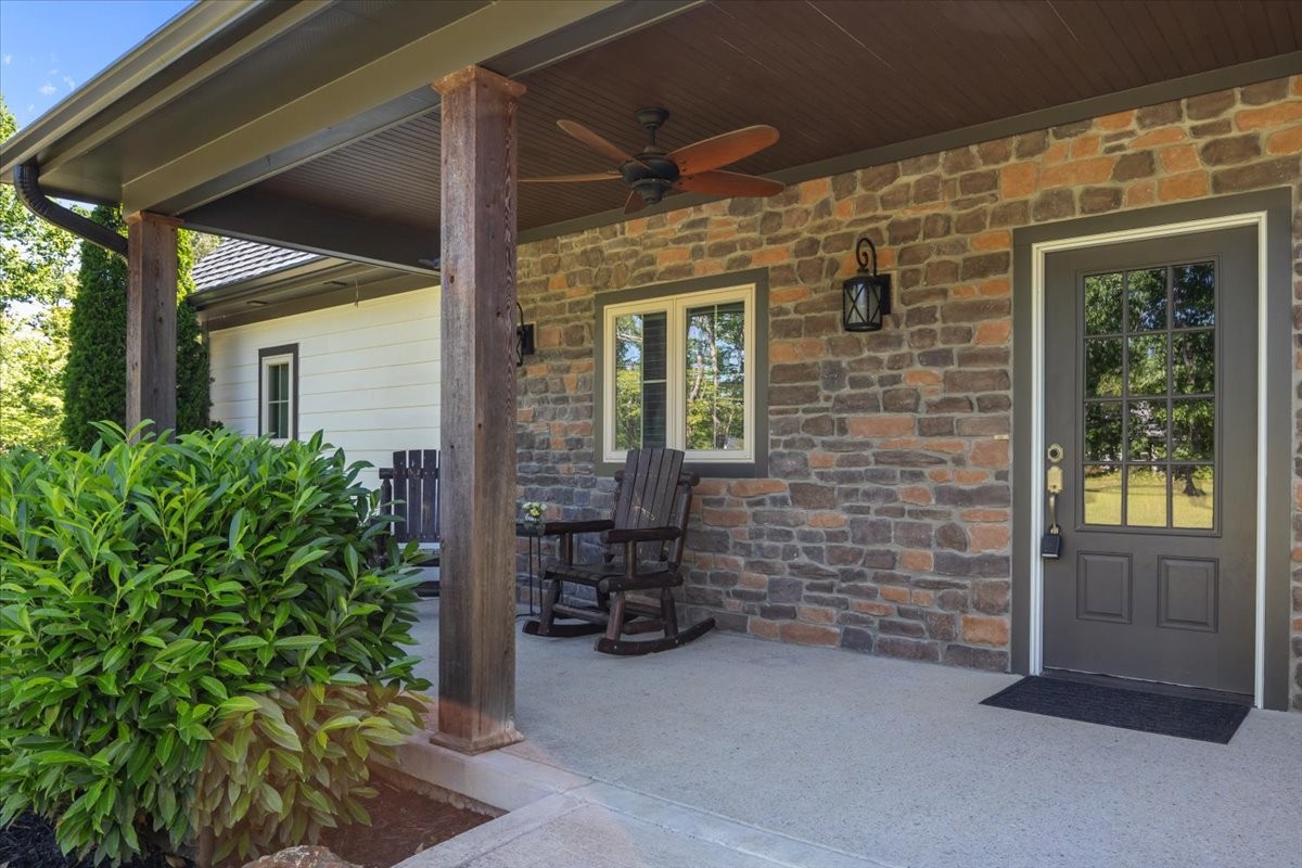 8006 Rose Ridge Pvt Lane Fairview, TN 37062 - Photo 6 of 87 a view of front door of house with outdoor seating