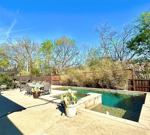 a view of a park with large trees