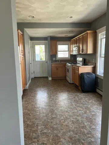 a view of a kitchen with a sink cabinets and a window