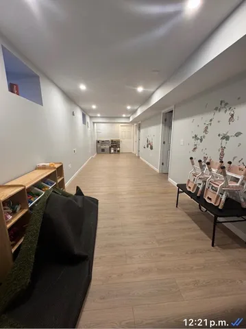 a room with furniture and a wooden floor