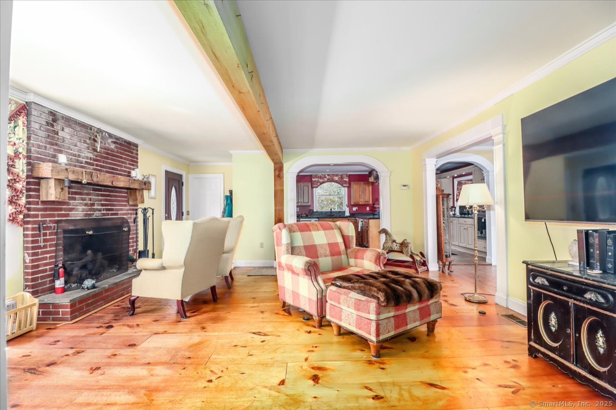 5 Laurel Hill Road North Sherman, CT 06784 - Photo 16 of 40 a living room with furniture a rug and a fireplace