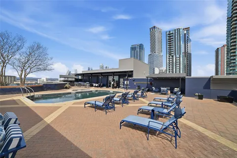 a view of a swimming pool with chairs