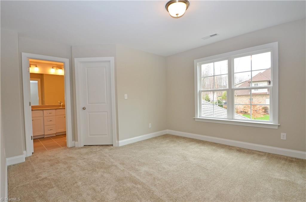5571 Salem View Road Pfafftown, NC 27040 - Photo 19 of 27 Bedroom 2 with walk in closet and shared bath