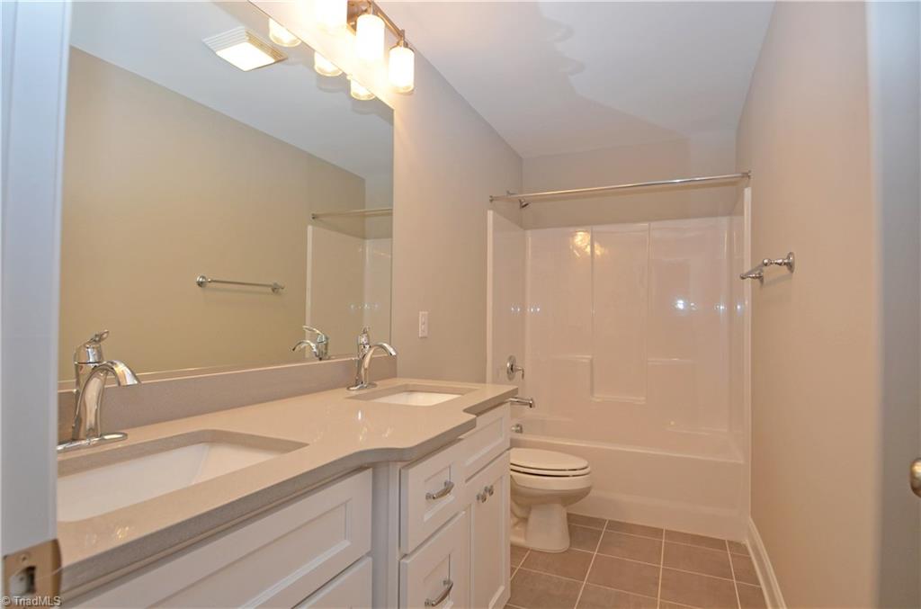 5571 Salem View Road Pfafftown, NC 27040 - Photo 21 of 27 Shared bath has dual sinks and quartz counters.