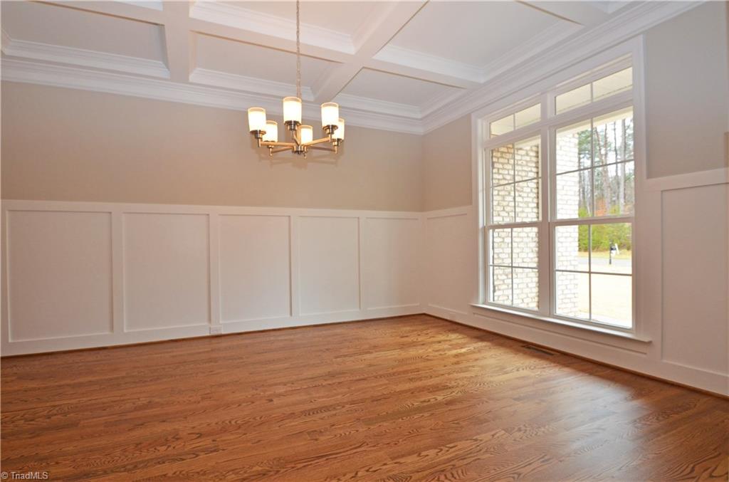 5571 Salem View Road Pfafftown, NC 27040 - Photo 5 of 27 Dining room has coffered ceiling and wainscoting.