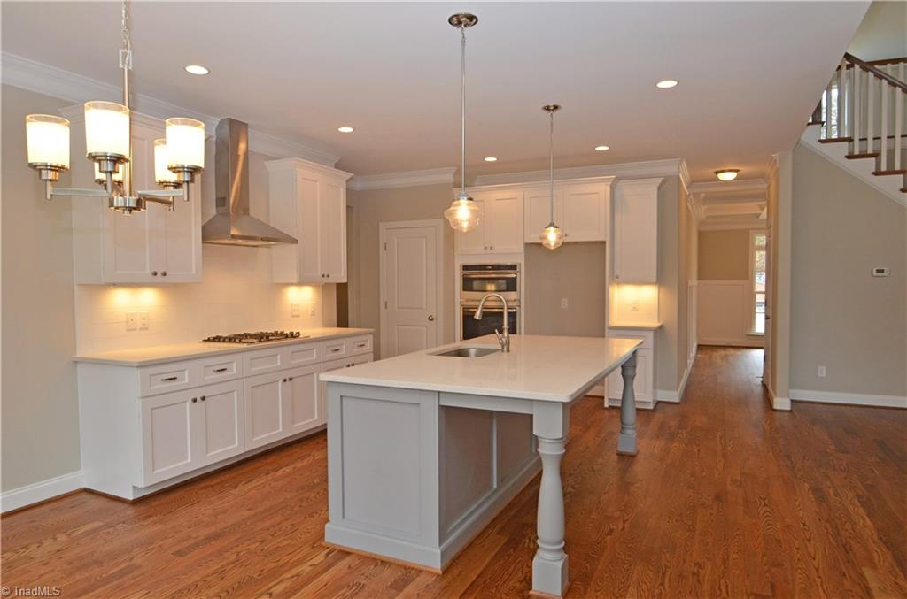 5571 Salem View Road Pfafftown, NC 27040 - Photo 8 of 27 Kitchen has soft close cabinets and under cabinet lighting.