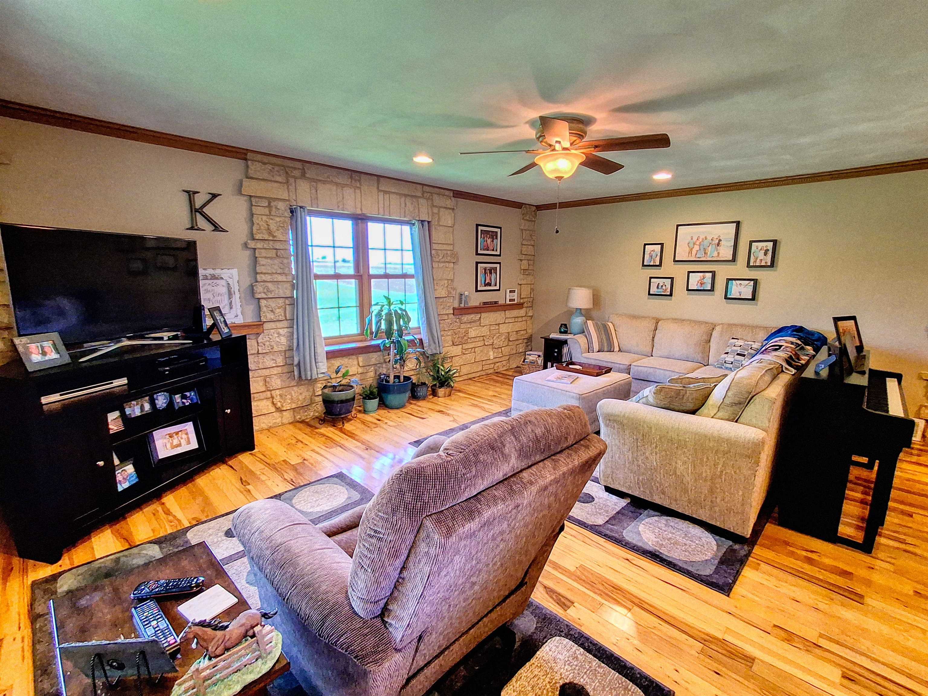 7009 West Pearl City Road Freeport, IL 61032 - Photo 13 of 35 a living room with furniture and a flat screen tv