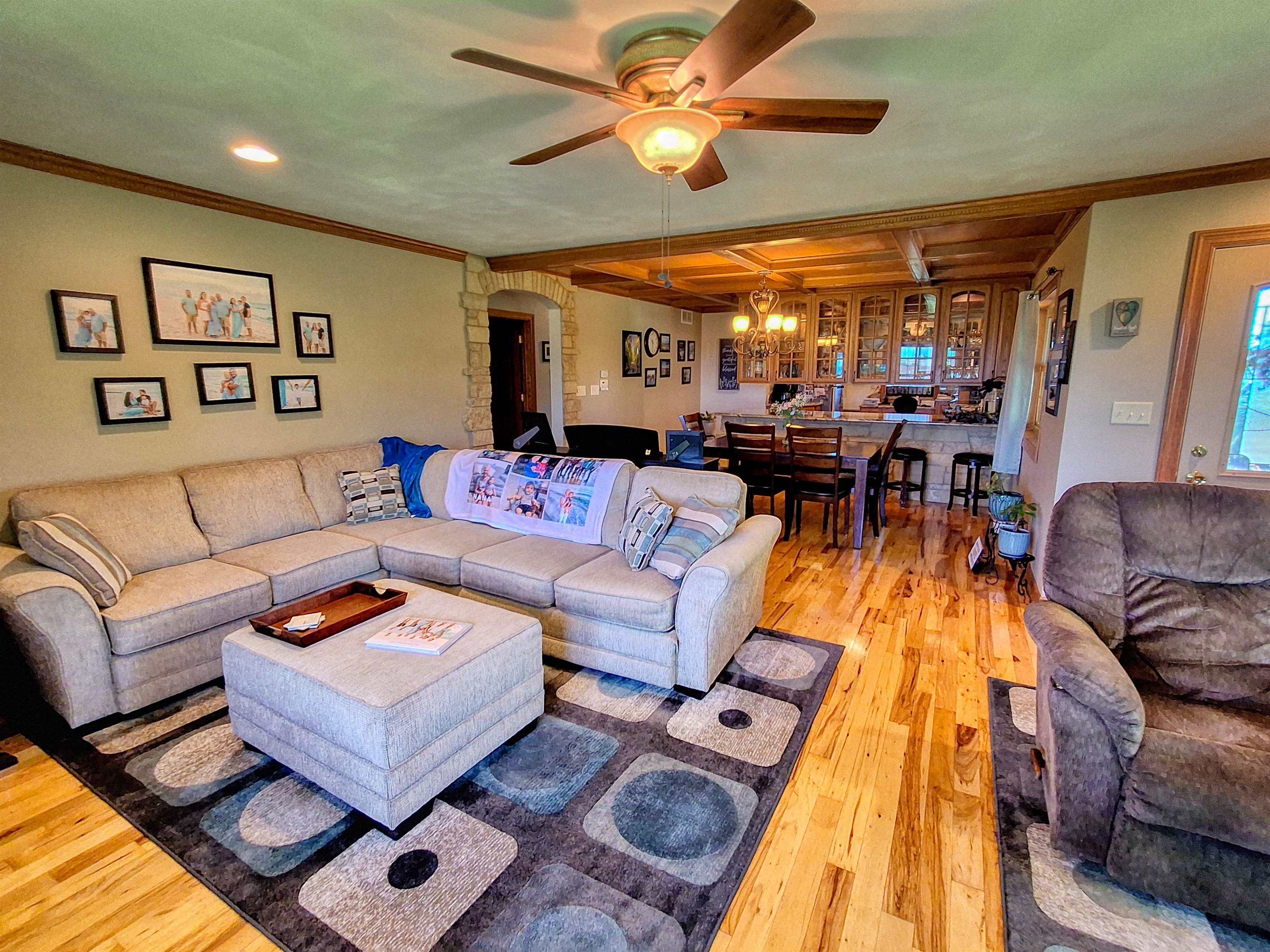 7009 West Pearl City Road Freeport, IL 61032 - Photo 14 of 35 a living room with furniture and a chandelier