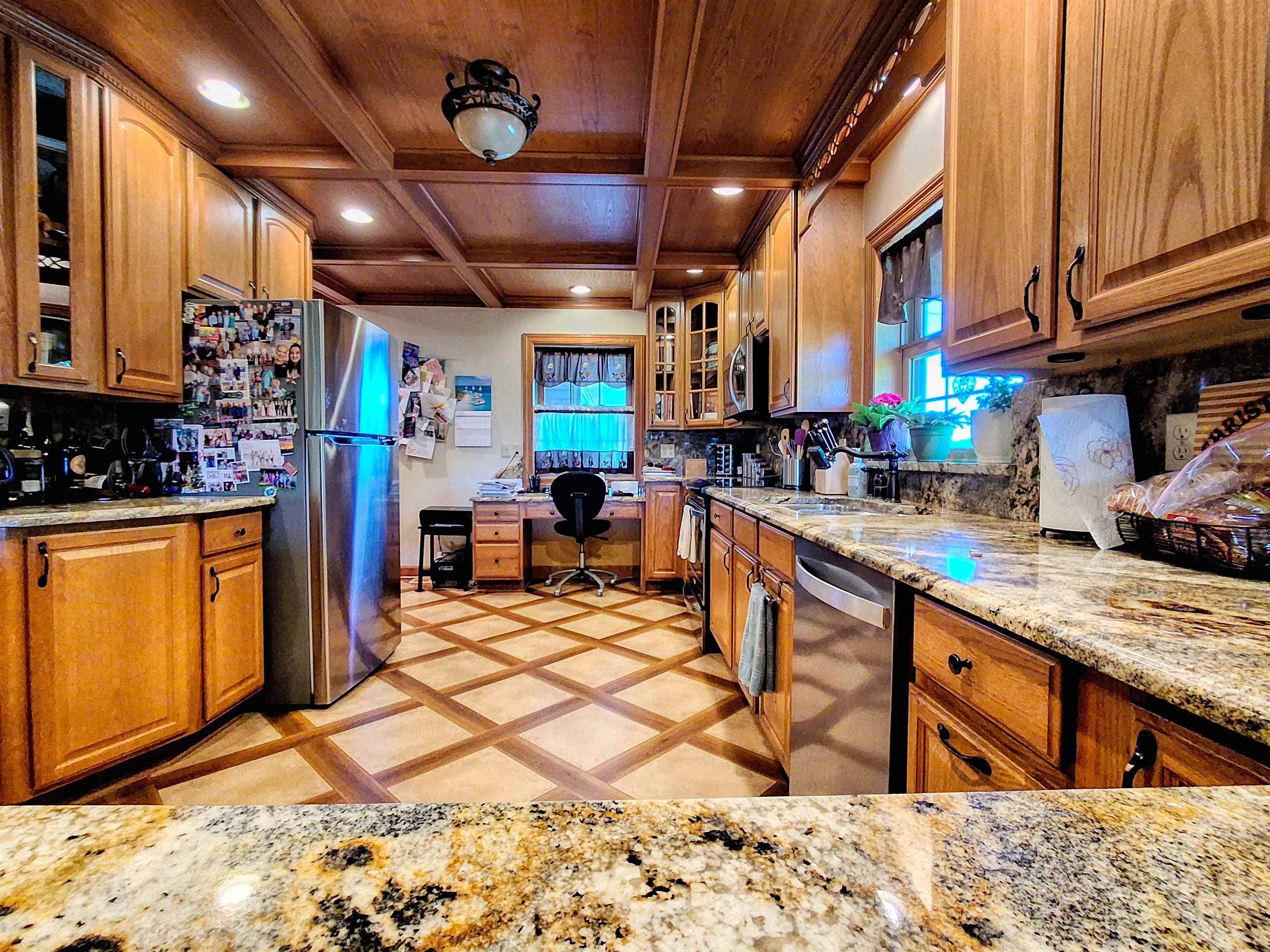 7009 West Pearl City Road Freeport, IL 61032 - Photo 7 of 35 a kitchen with stainless steel appliances granite countertop a sink a stove a refrigerator cabinets and dining table