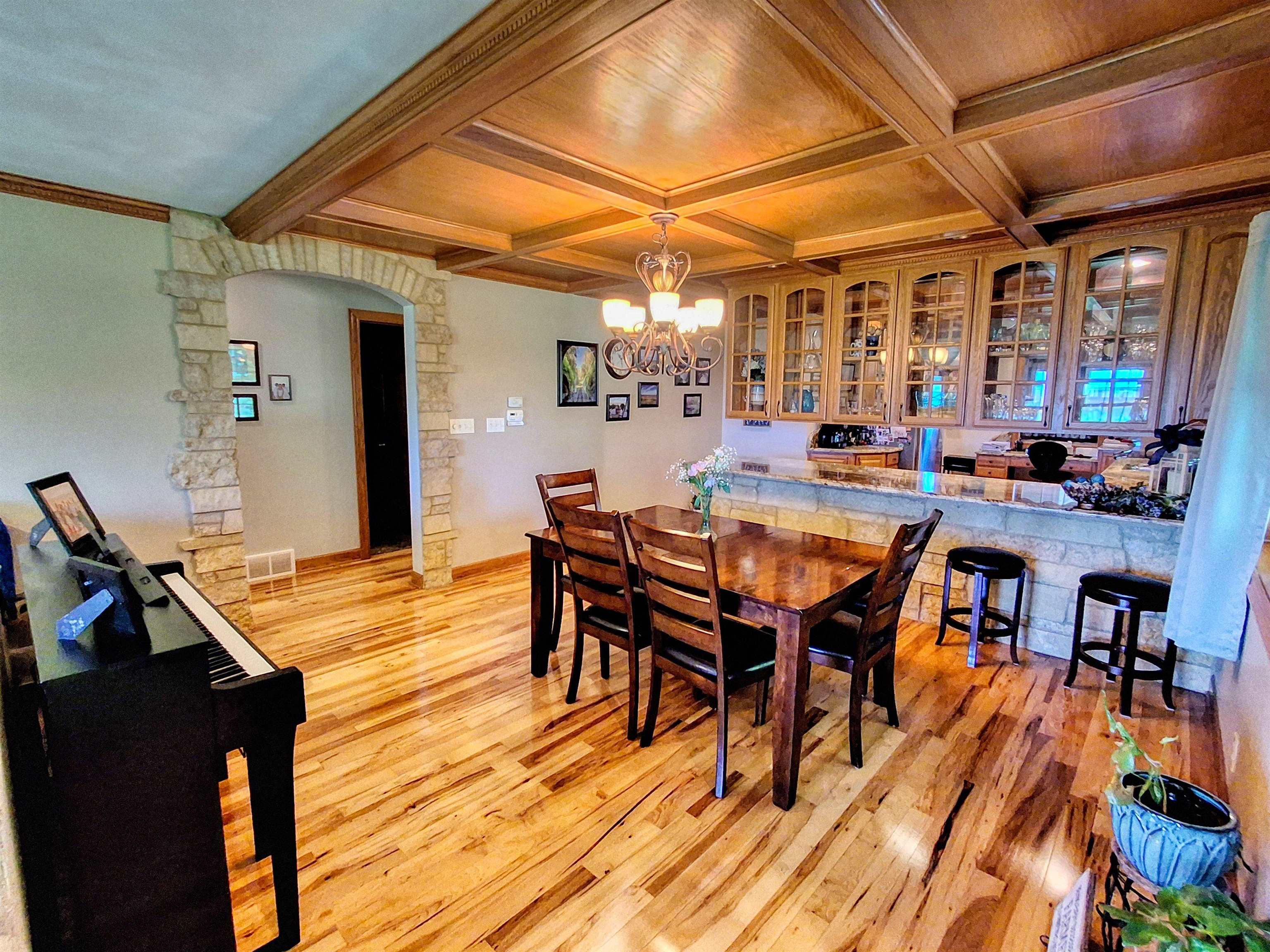 7009 West Pearl City Road Freeport, IL 61032 - Photo 9 of 35 a view of a dining room with furniture and wooden floor
