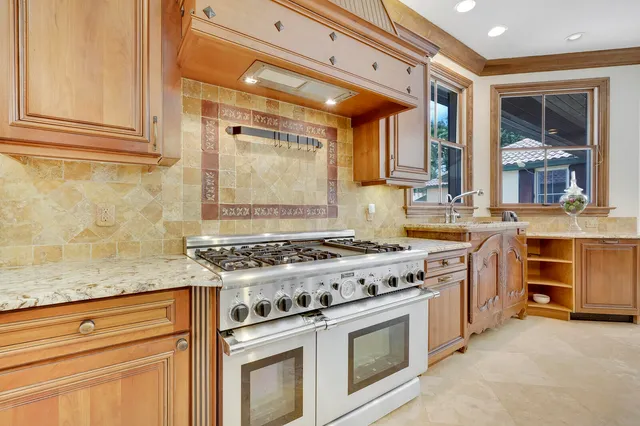 a bathroom with a sink a vanity and a window