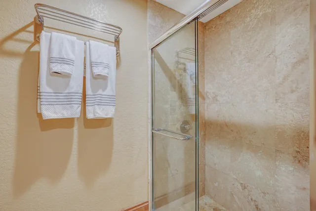 a bedroom with furniture and a flat screen tv