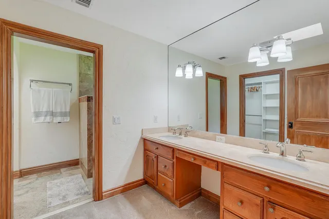 a bedroom with a large bed and a flat screen tv