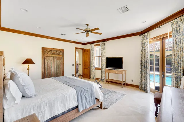 a spacious bathroom with a double vanity sink a mirror and a bathtub