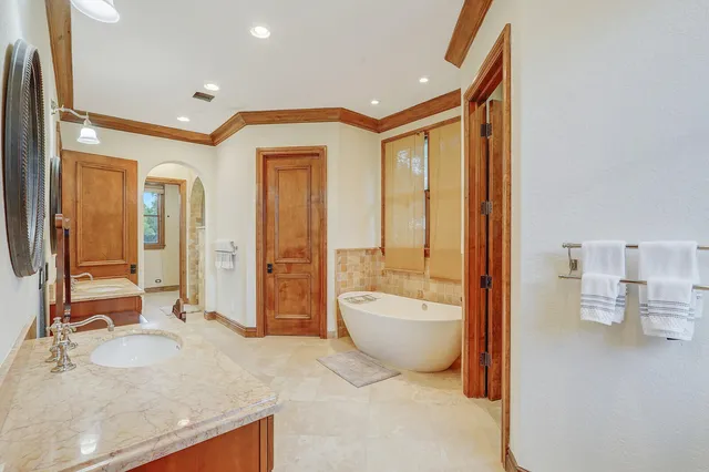 a view of a swimming pool with an outdoor seating