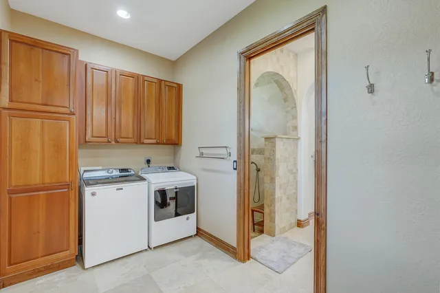 a view of a patio with dining table and chairs with a yard