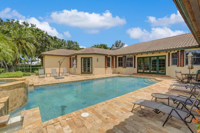 a kitchen with stainless steel appliances granite countertop a stove and a refrigerator