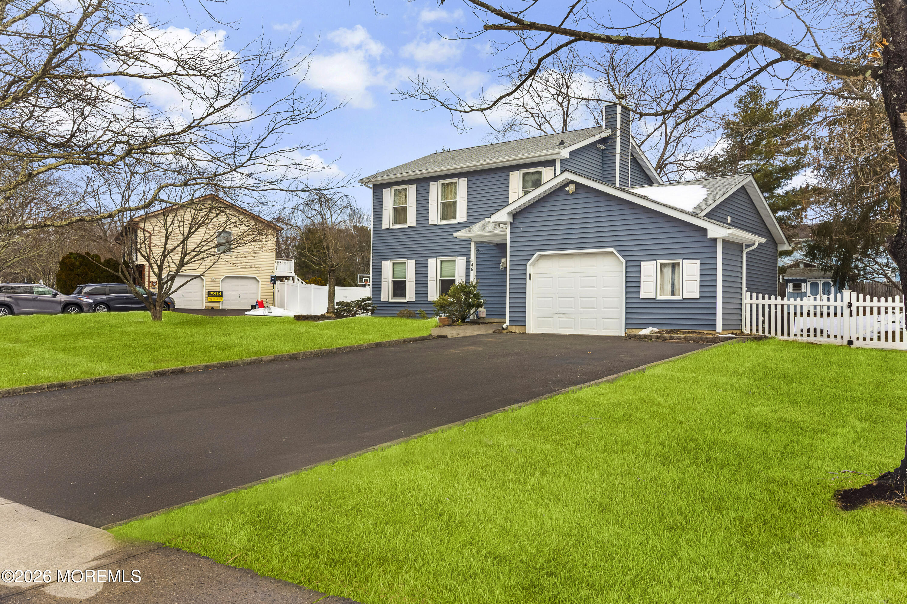 46 Hickory Hill Road Jackson, NJ 08527 - Photo 2 of 33 a front view of a house with a yard and trees