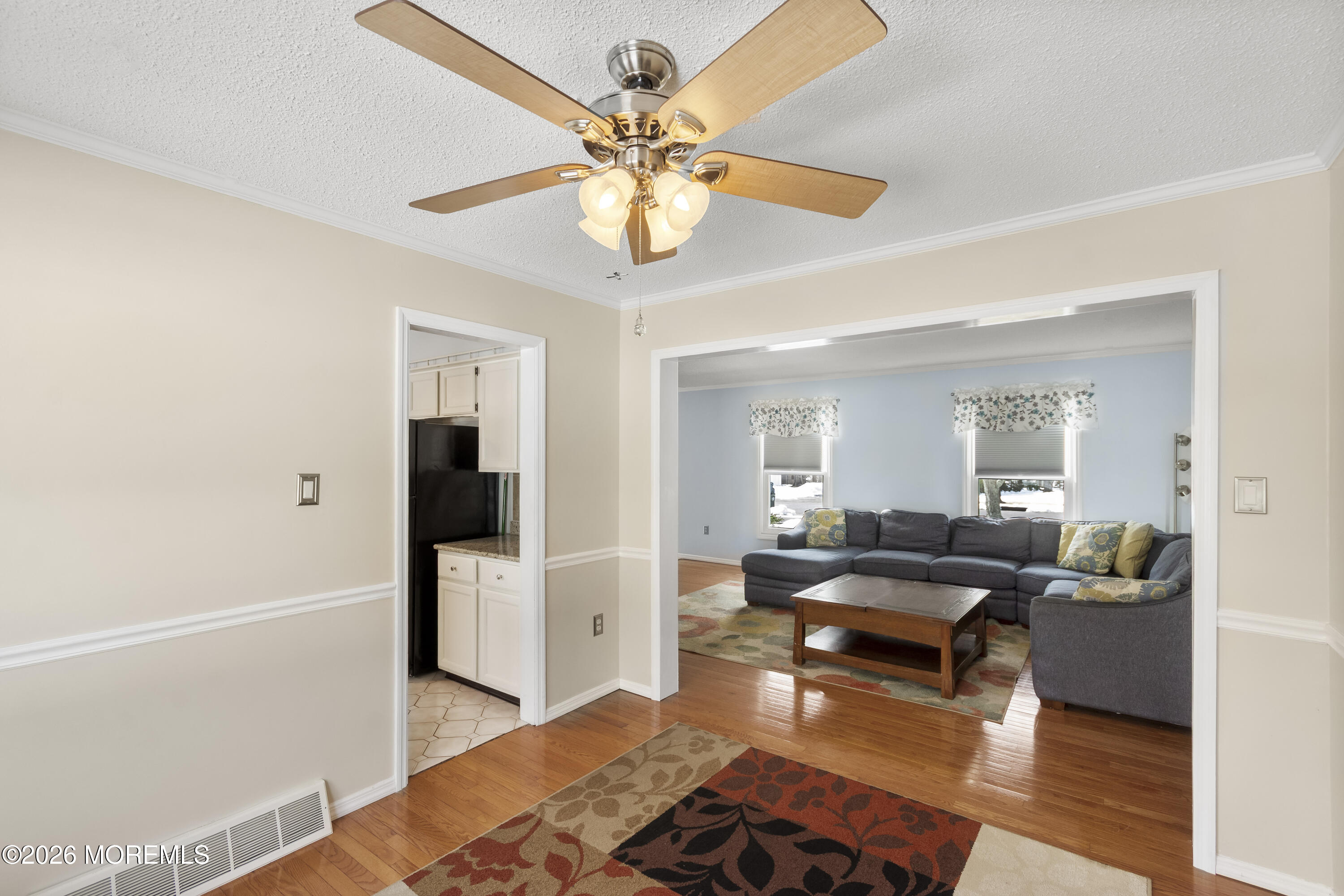 46 Hickory Hill Road Jackson, NJ 08527 - Photo 8 of 33 a living room with furniture and a chandelier