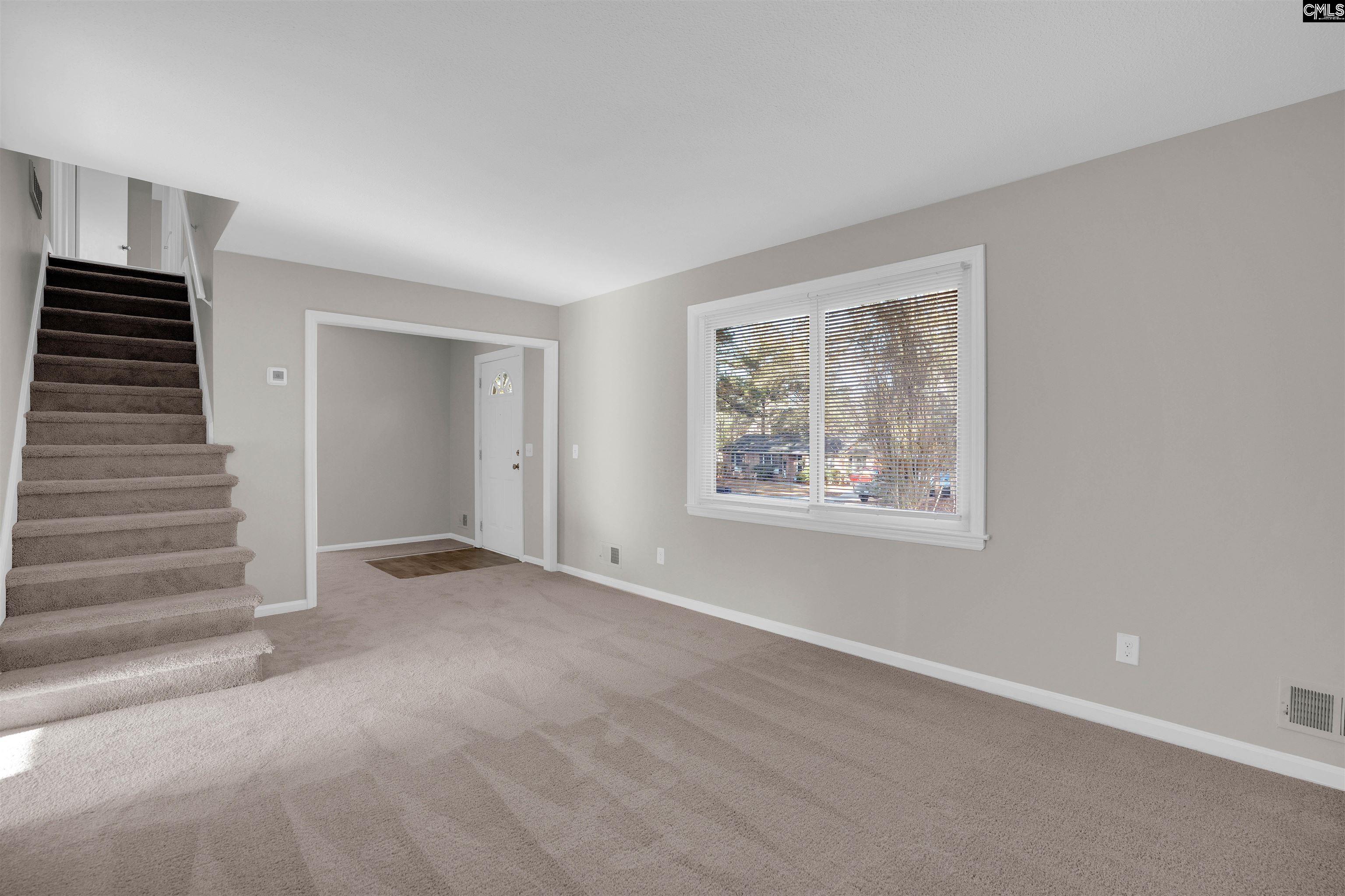 2620 Pleasant Ridge Drive Columbia, SC 29209 - Photo 6 of 37 a view of an empty room with stairs and a window